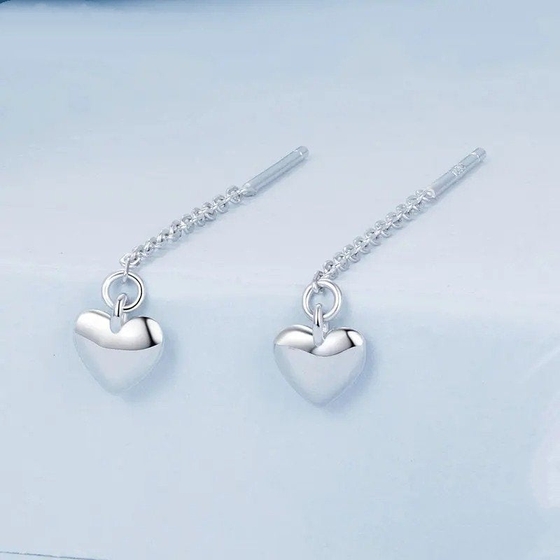 Boucles d'oreilles pendantes en forme de cœur simples avec longs glands